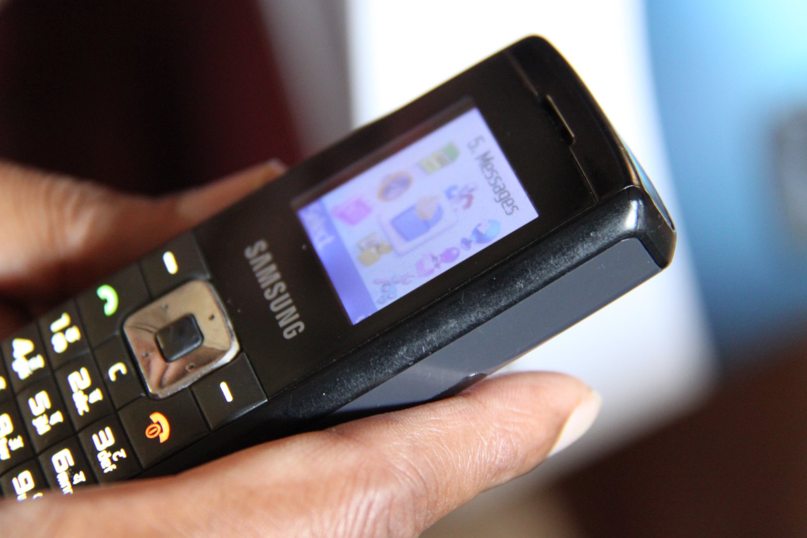 Smartphone display used to compare screen quality and everyday visibility